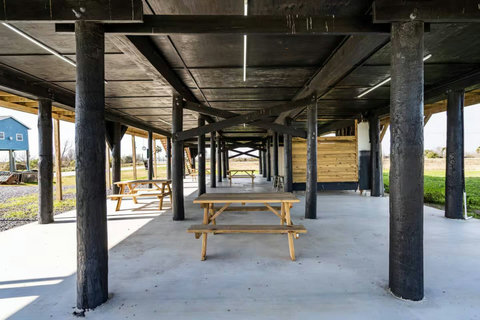 Shaded patio with picnic tables