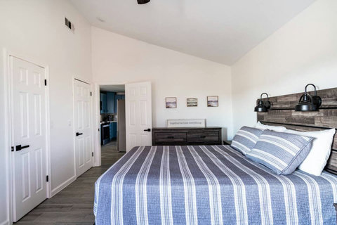 Queen bedroom with a rustic headboard