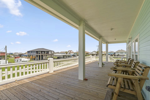 Tall deck chairs with a breeze off the Gulf