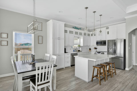 Dining table by the window, steps from the kitchen
