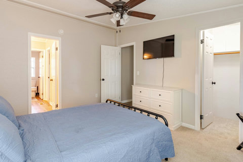Queen bedroom with a TV
