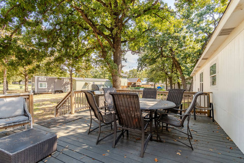 Deck with outdoor dining under the oak trees