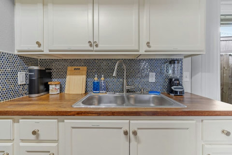 Butcher-block counters and a hexagon tile backsplash