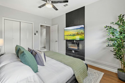 Bedroom with an electric fireplace and smart TV