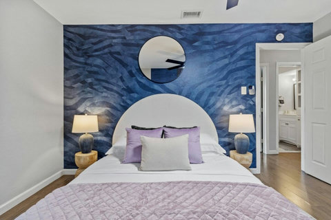Bedroom with a dramatic blue accent wall
