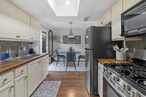 Kitchen with a gas range, open to the dining area
