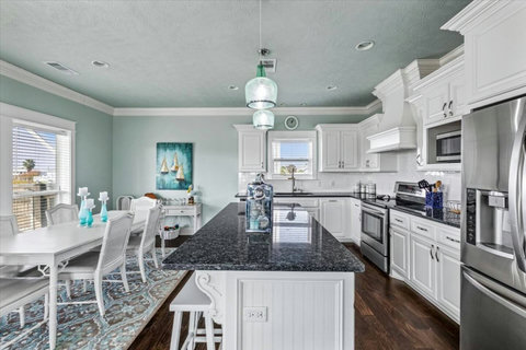 Kitchen island with the dining table beside it