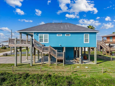Stairs up to the deck and a shaded patio below