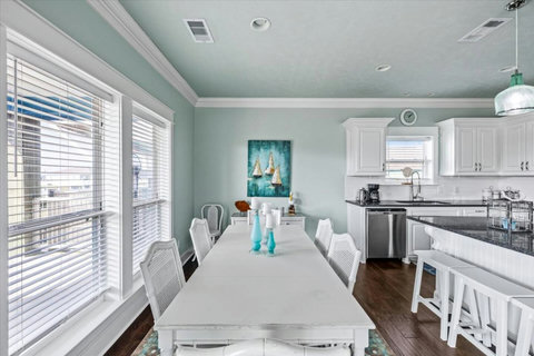 Long dining table next to the kitchen
