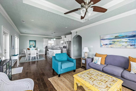 Living area opens to the dining table and kitchen