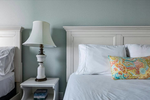 Fresh white linens on every bed