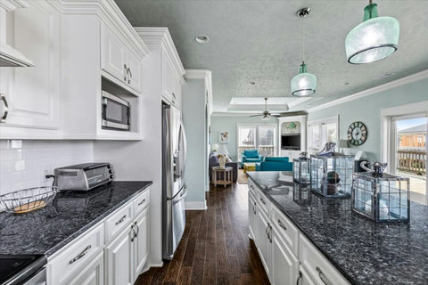Kitchen looks out to the living room