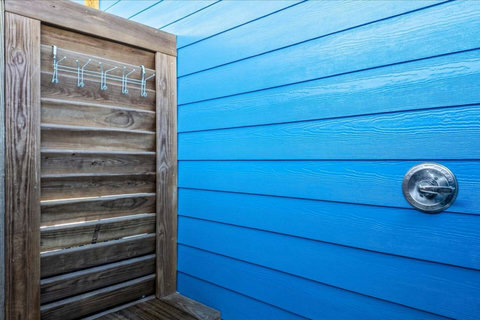 Outdoor shower with towel hooks