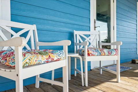 Cushioned chairs by the front door