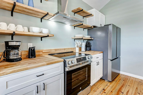 Open shelves stocked with dishes