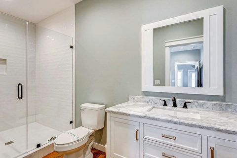 Private bath with a glass shower