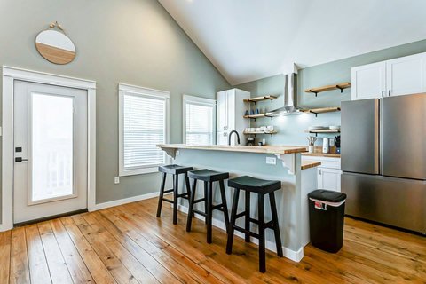 Kitchen with butcher-block counters and bar seating