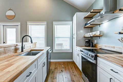Galley kitchen with stainless appliances