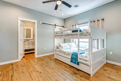 Bunk room with a barn door