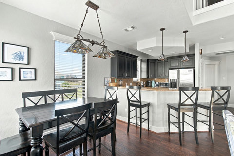 Dining table next to the kitchen bar