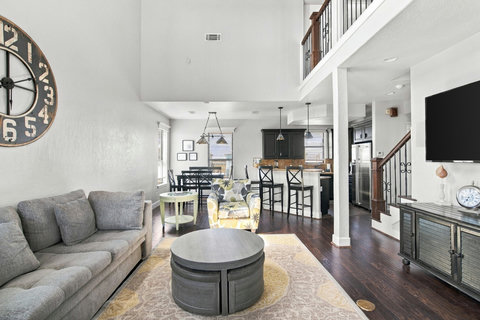 Living room open to the dining area and kitchen bar