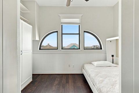 Murphy bed with arched windows