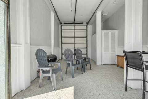 Chairs and a grill in the downstairs room