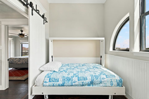 Murphy bed tucked behind barn doors