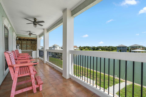 Tall chairs on the covered balcony