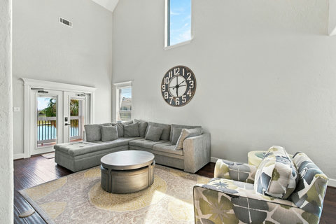 French doors open to the water