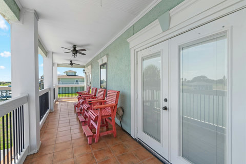 French doors open to the balcony
