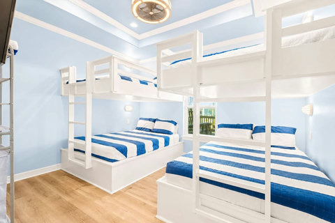 Bunk room with two queen-over-queen bunks