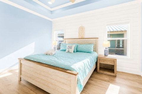 King bed with soft aqua bedding