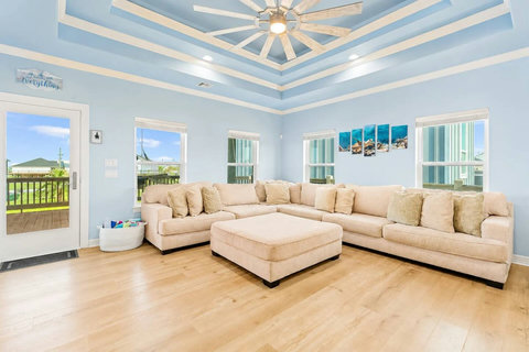Bright living room with a big sectional and ottoman