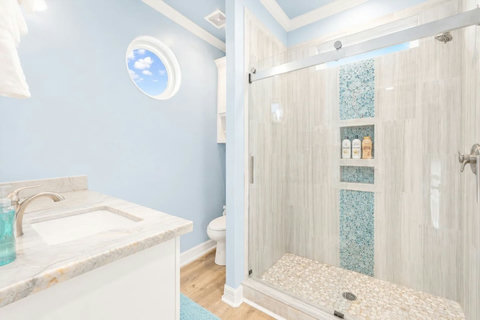 Primary bath with a glass walk-in shower