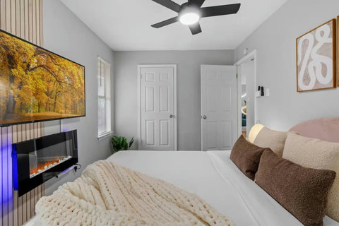Electric fireplace and smart TV by the bed