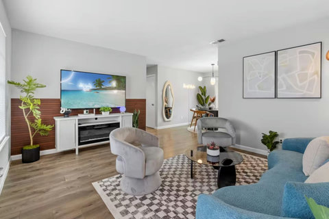 Living room with a big smart TV and electric fireplace