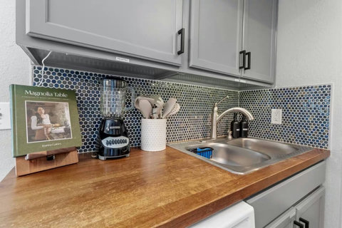 Butcher-block counters and a hexagon tile backsplash