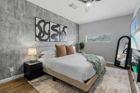 Bedroom with a floor mirror