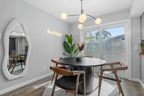 Round dining table with sliding doors to the patio