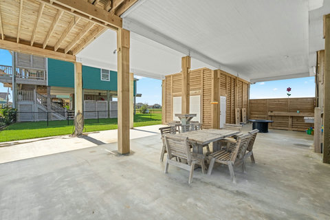 Outdoor dining table under the house
