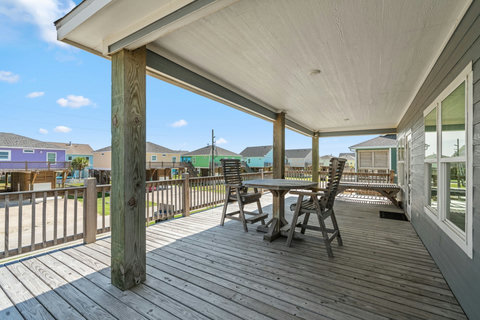 Covered deck with a dining table