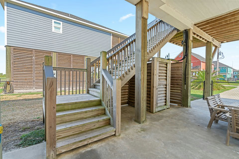 Stairs up to the deck from the patio