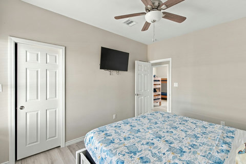 Second king bedroom with a wall TV