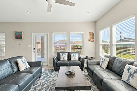 Leather sofas and a door to the deck