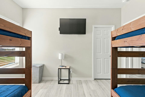 Bunk room with a TV