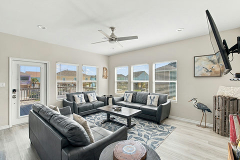Living room with leather sofas and a smart TV