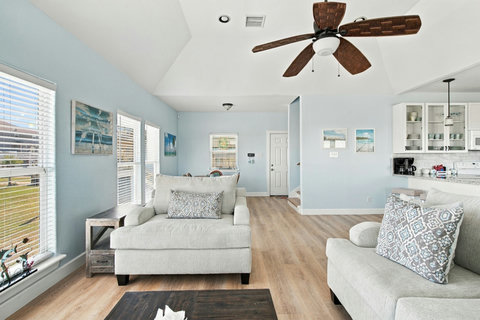 Sunny living room with a loveseat and armchair