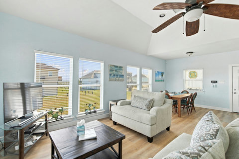 Living room with the dining table by the windows