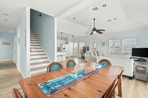Dining table, with stairs up to the primary suite